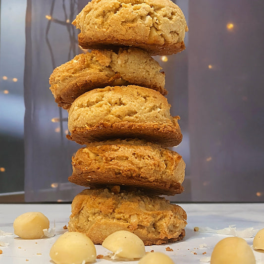 five Taste of the Island Cookies stacked ontop each other [macadamia nuts|white chocolate|coconut]